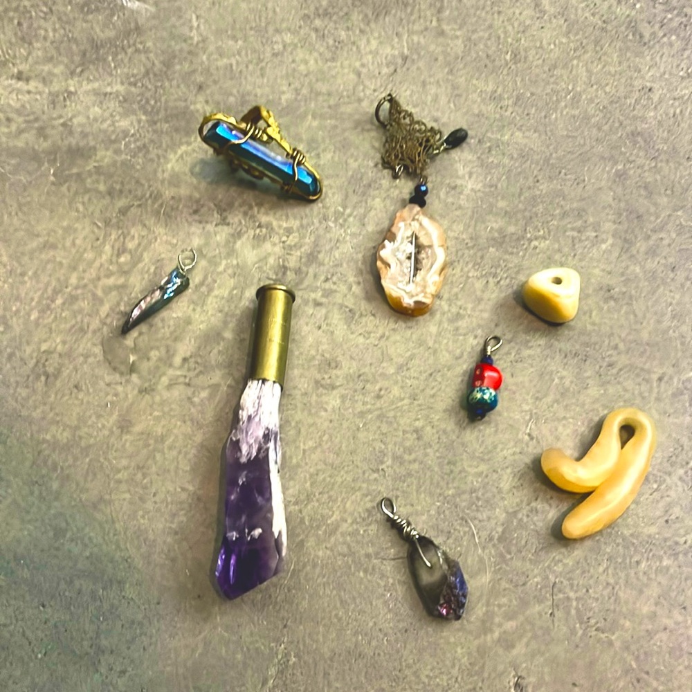 Handmade ring and necklace pendants.